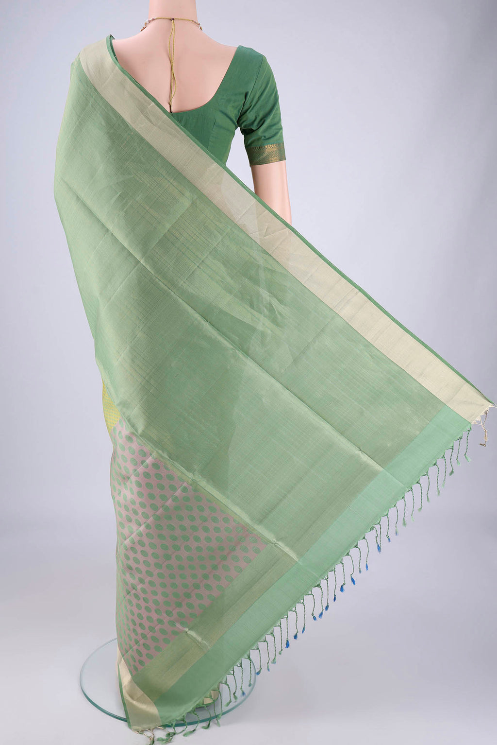 Flat view of Multi Color Soft Silk Saree with Thread Butta on the body and Zari Border. 
