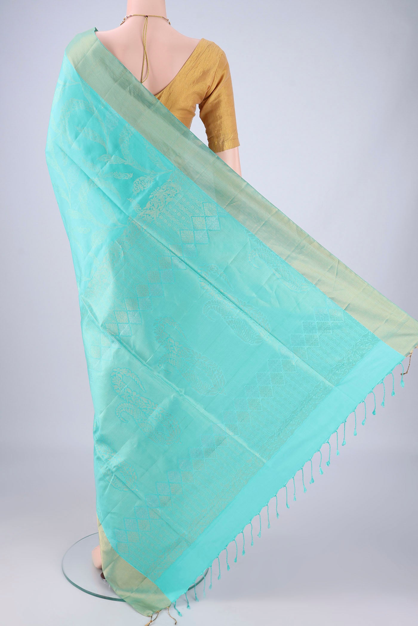 Flat view of Turquoise Soft Silk Saree with Zari Butta on the body and Zari Border. 