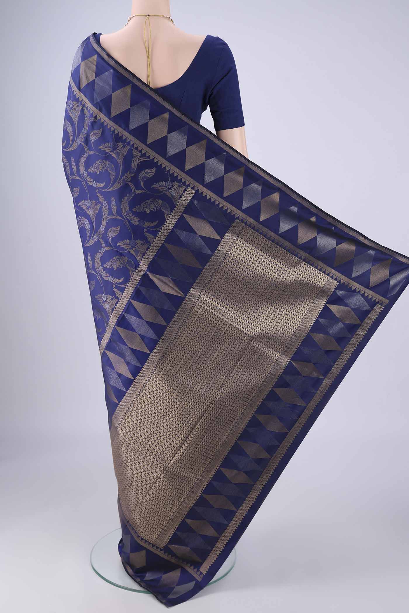 Flat view of Navy Blue Soft Silk Saree with Zari Brocade on the body and Zari Border. 