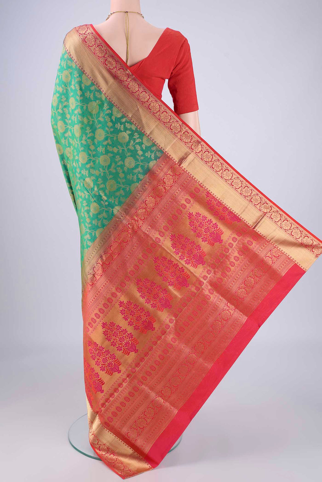 Flat view of Green Soft Silk Saree with Zari Brocade on the body and Zari Border. 