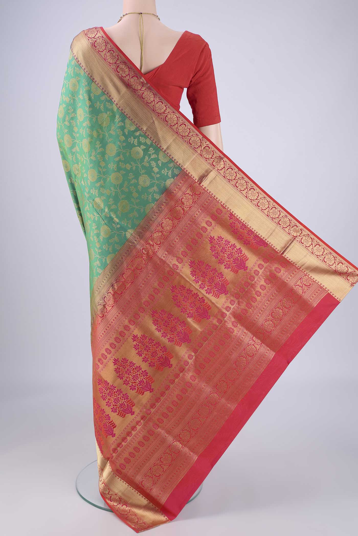 Flat view of Green Soft Silk Saree with Zari Brocade on the body and Zari Border. 