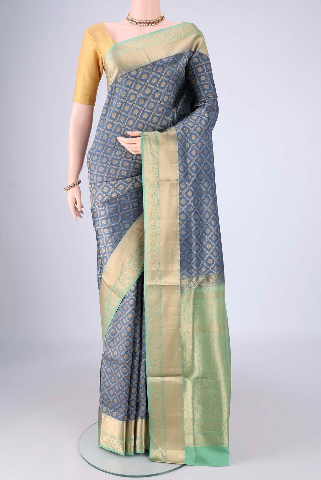 Maya Blue Soft Silk Saree with Zari Brocade on the body and Zari Border.  displayed on a mannequin