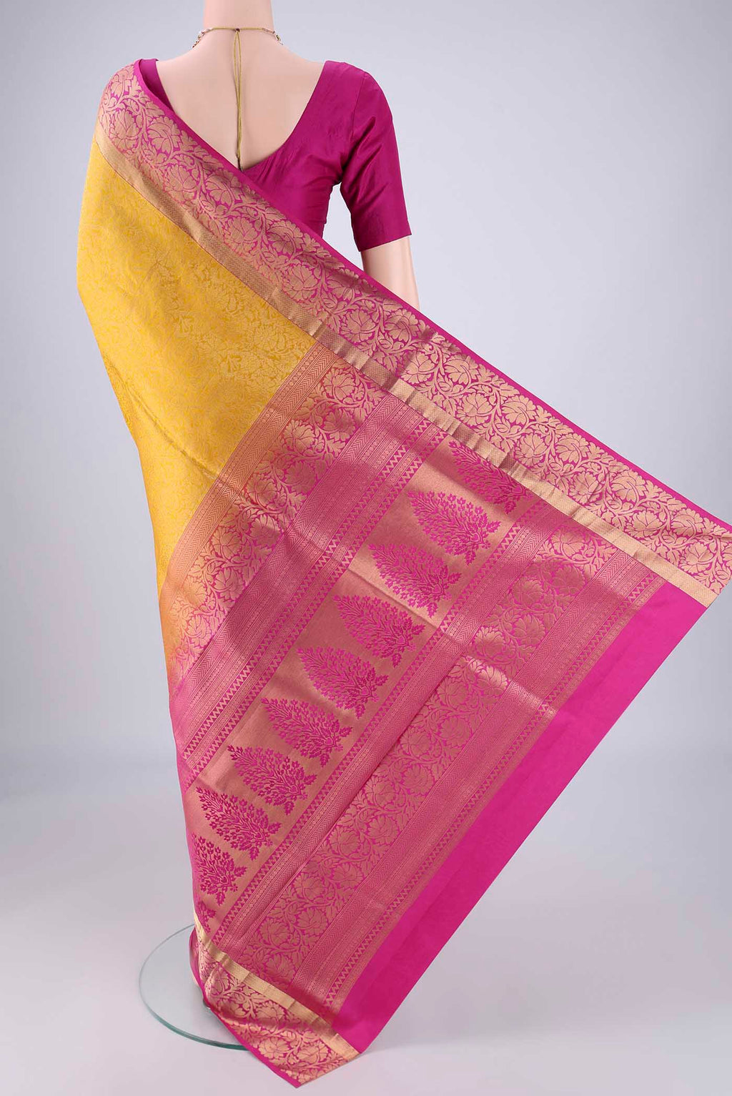 Flat view of Yellow Soft Silk Saree with Zari Brocade on the body and Zari Border. 