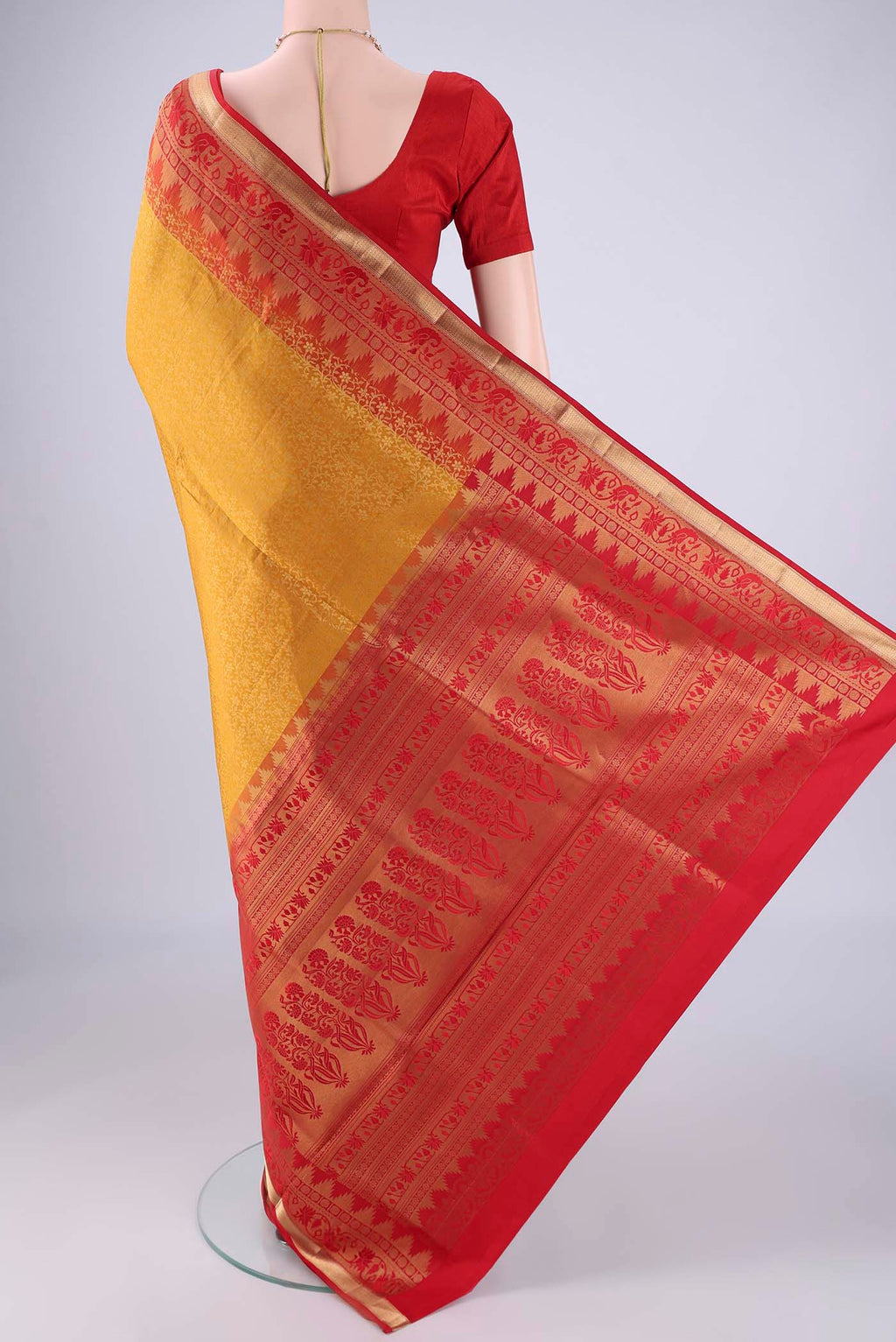 Flat view of Mustard Soft Silk Saree with Zari Brocade on the body and Zari Border. 