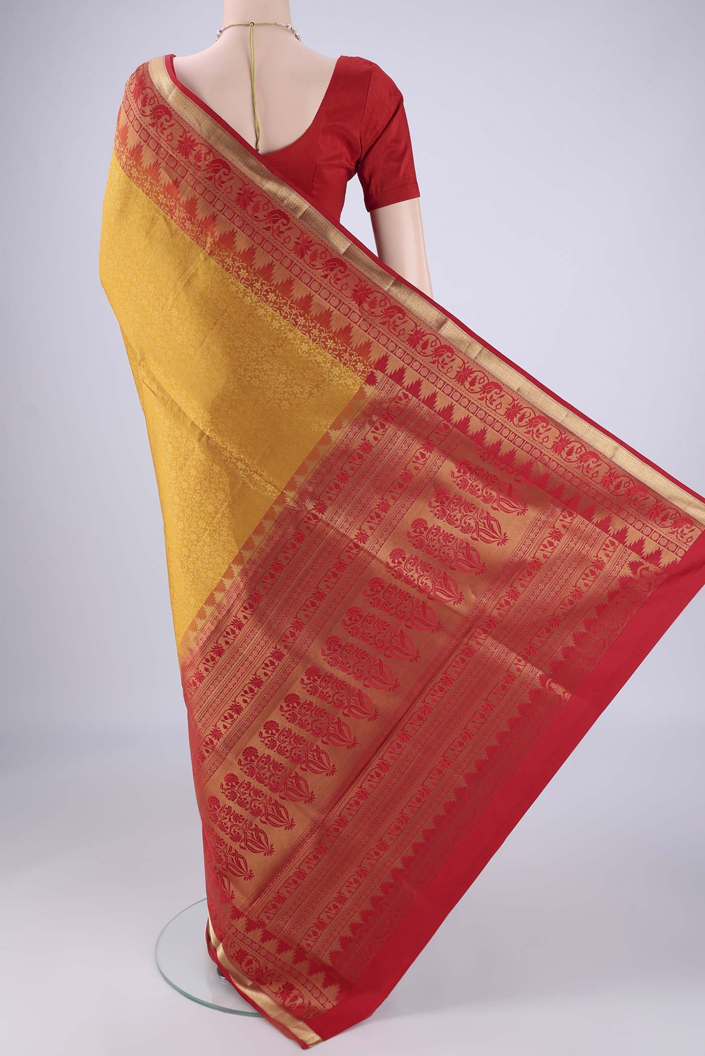 Flat view of Mustard Soft Silk Saree with Zari Brocade on the body and Zari Border. 