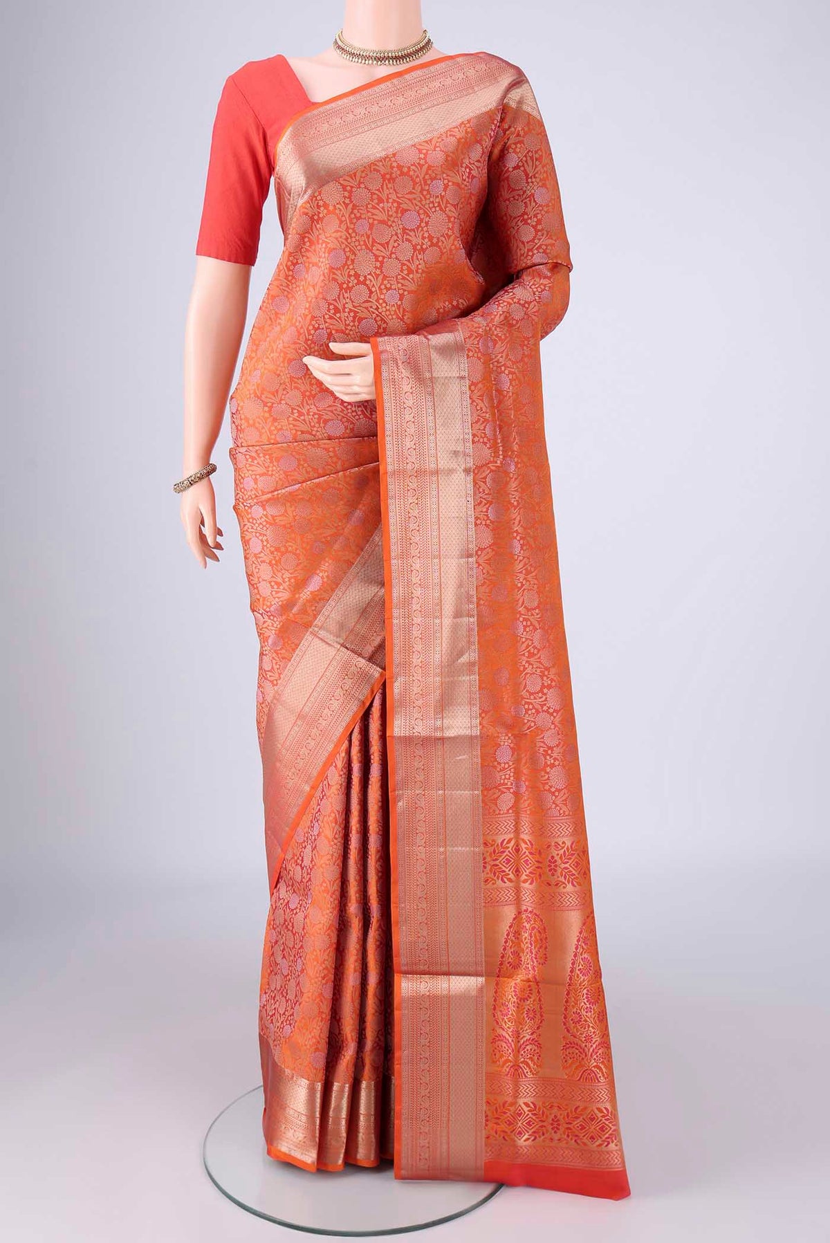 Brick Orange Dual Tone Soft Silk Saree with Zari Brocade on the body and Zari Border.  displayed on a mannequin