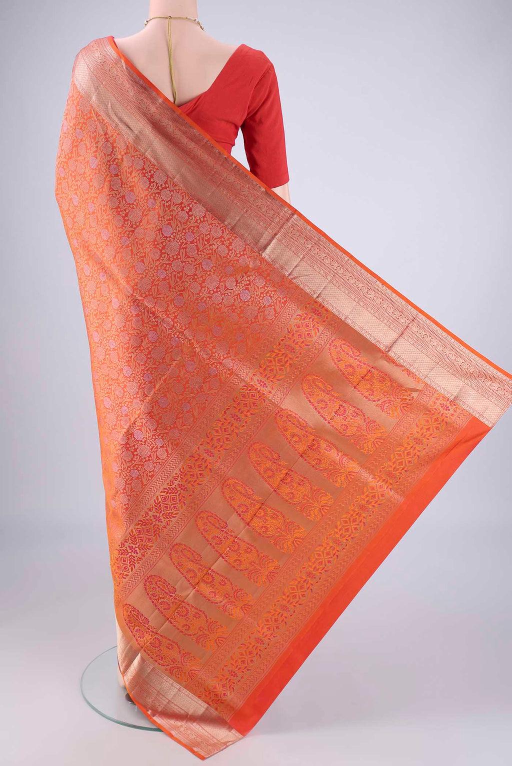 Flat view of Brick Orange Dual Tone Soft Silk Saree with Zari Brocade on the body and Zari Border. 