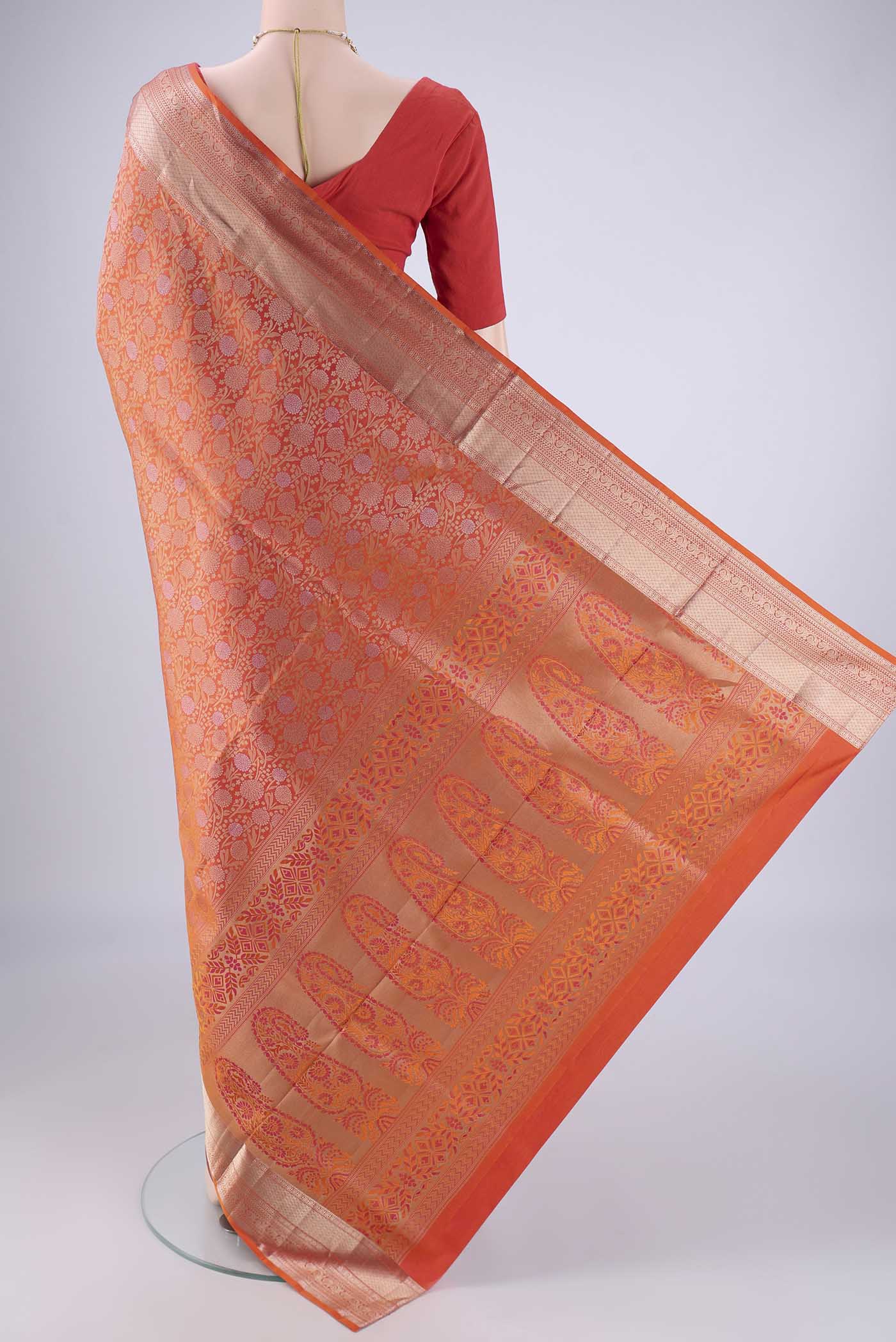 Flat view of Brick Orange Dual Tone Soft Silk Saree with Zari Brocade on the body and Zari Border. 