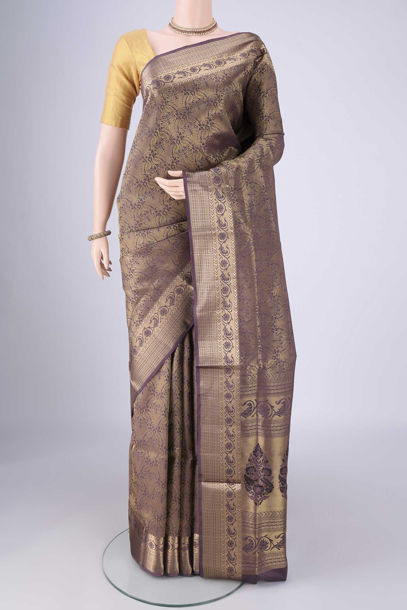 Dark Mauve Soft Silk Saree with Zari Brocade on the body and Zari Border.  displayed on a mannequin