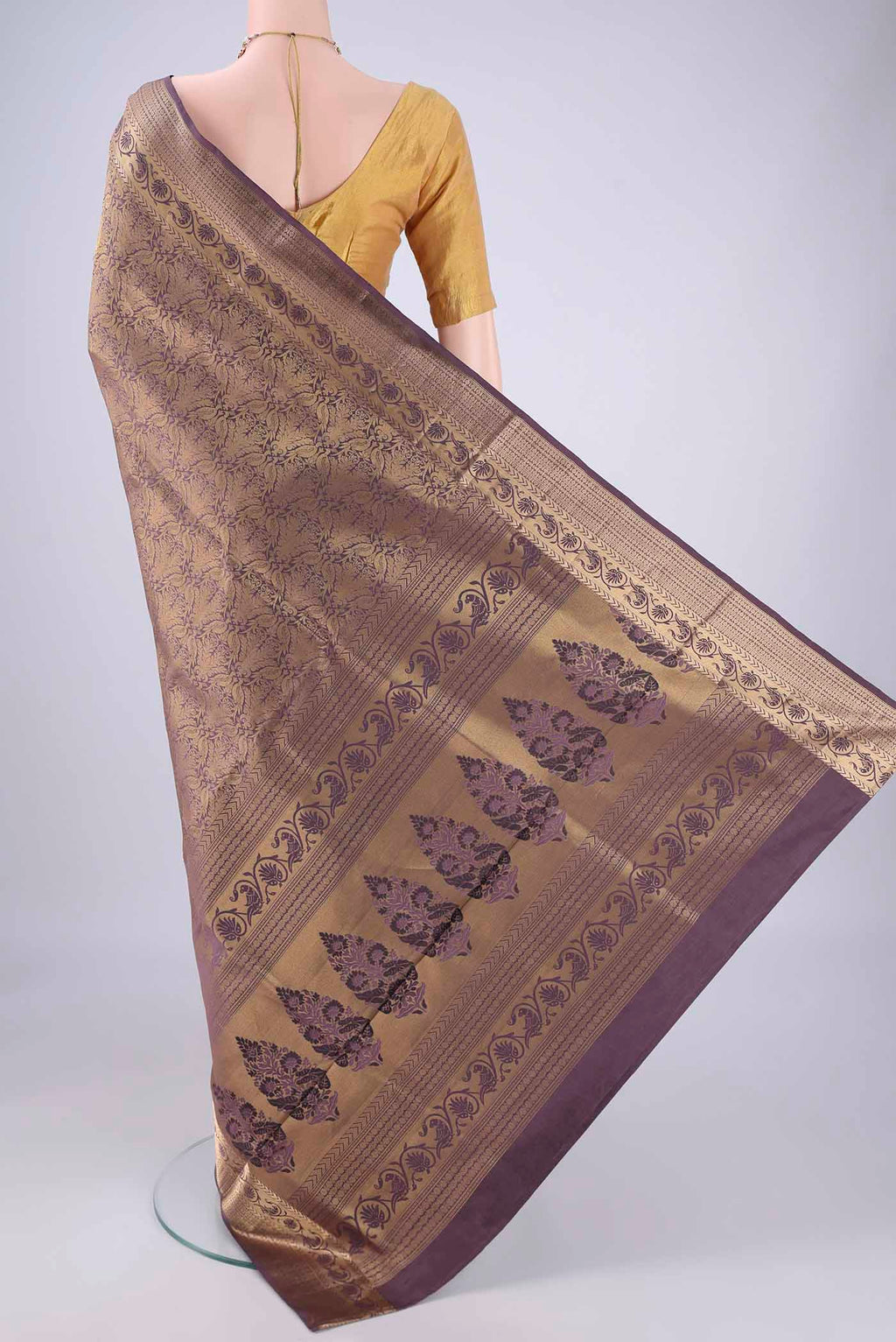 Flat view of Dark Mauve Soft Silk Saree with Zari Brocade on the body and Zari Border. 