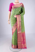 Green Soft Silk Saree with Zari Brocade on the body and Zari Border.  displayed on a mannequin