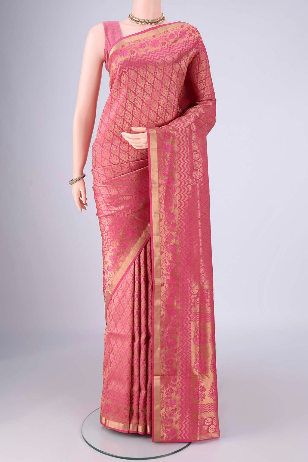 Pink Soft Silk Saree with Zari Brocade on the body and Zari Border.  displayed on a mannequin