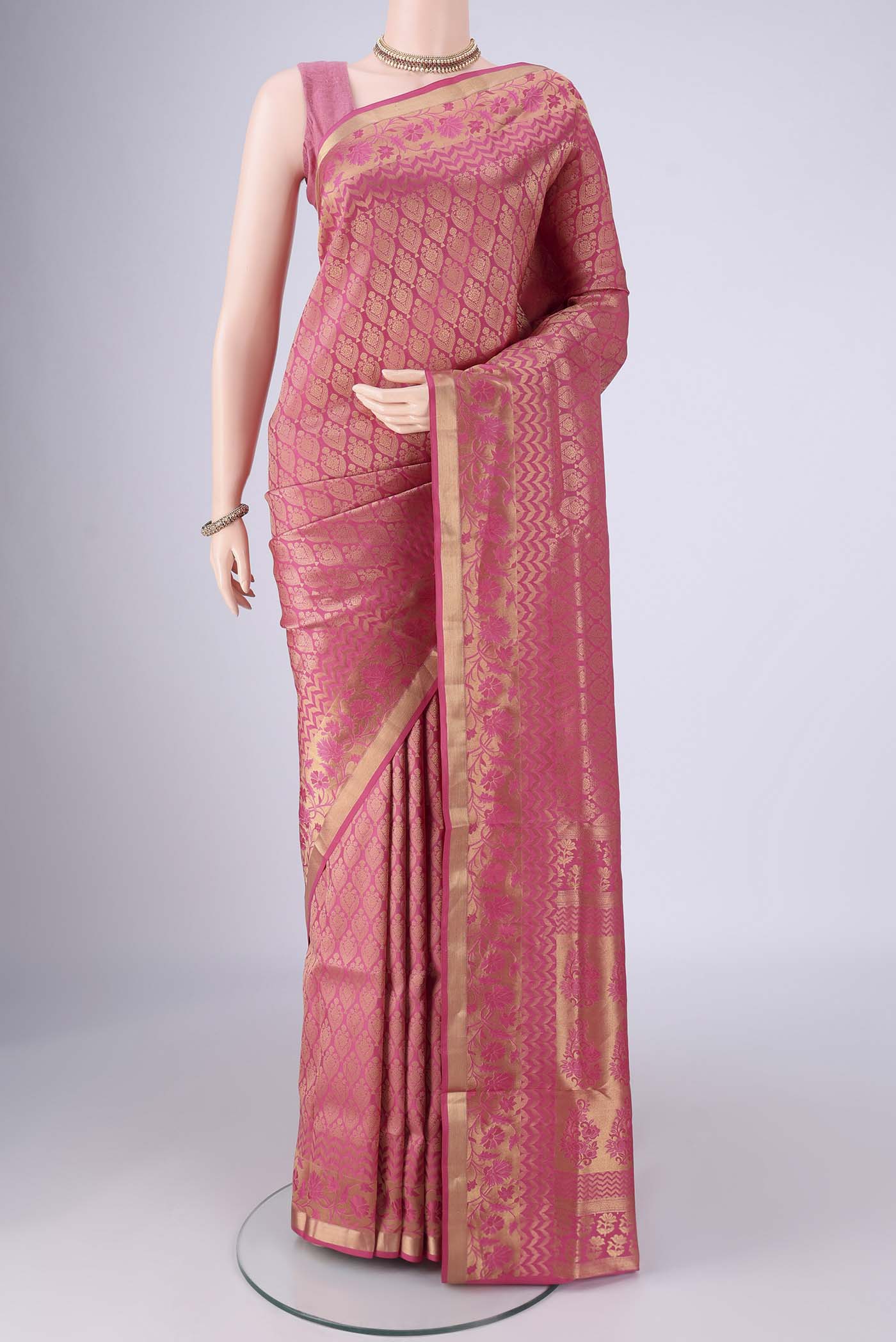 Pink Soft Silk Saree with Zari Brocade on the body and Zari Border.  displayed on a mannequin