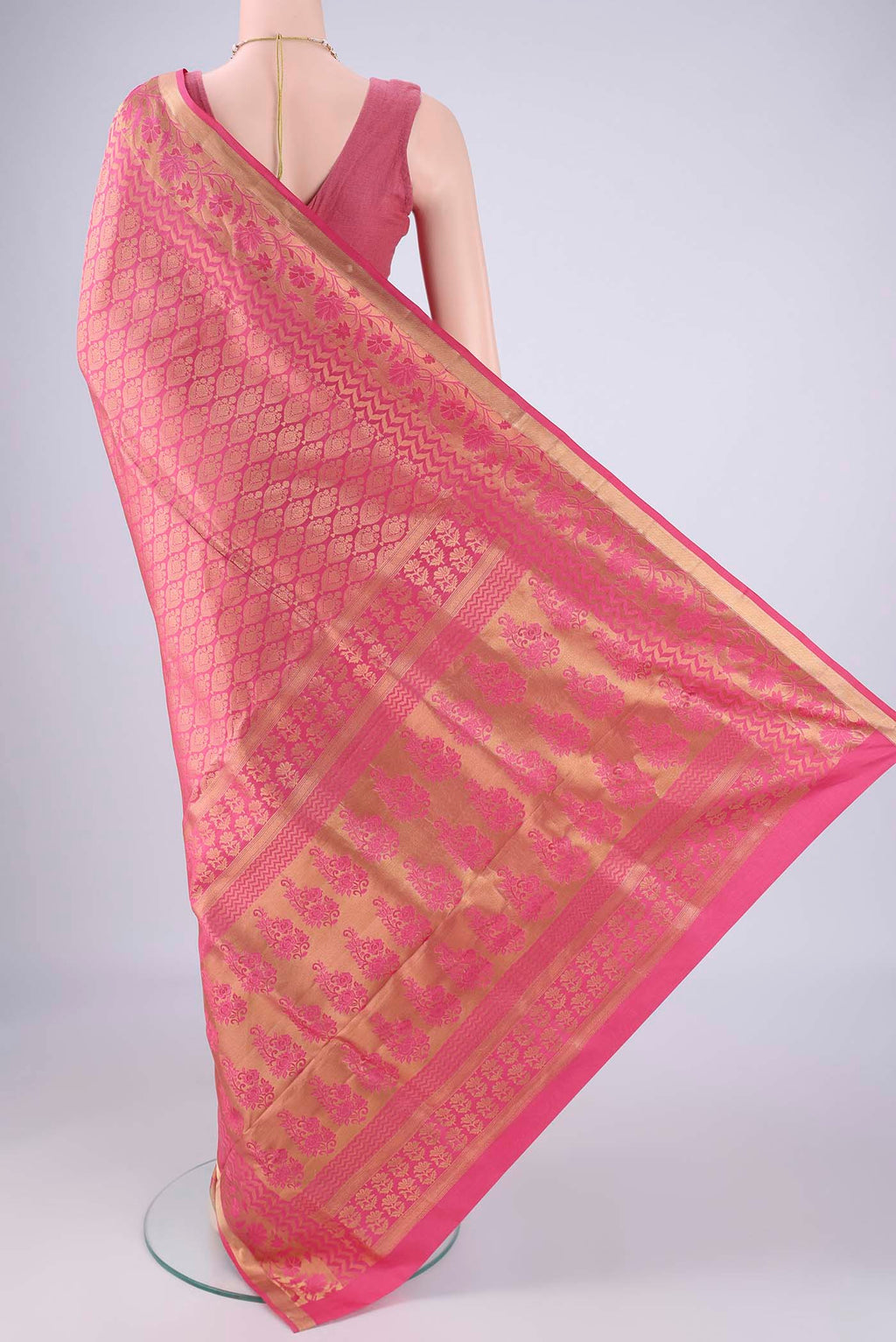 Flat view of Pink Soft Silk Saree with Zari Brocade on the body and Zari Border. 