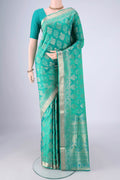 Turquoise Dual Tone Soft Silk Saree with Zari Butta on the body and Zari Border.  displayed on a mannequin