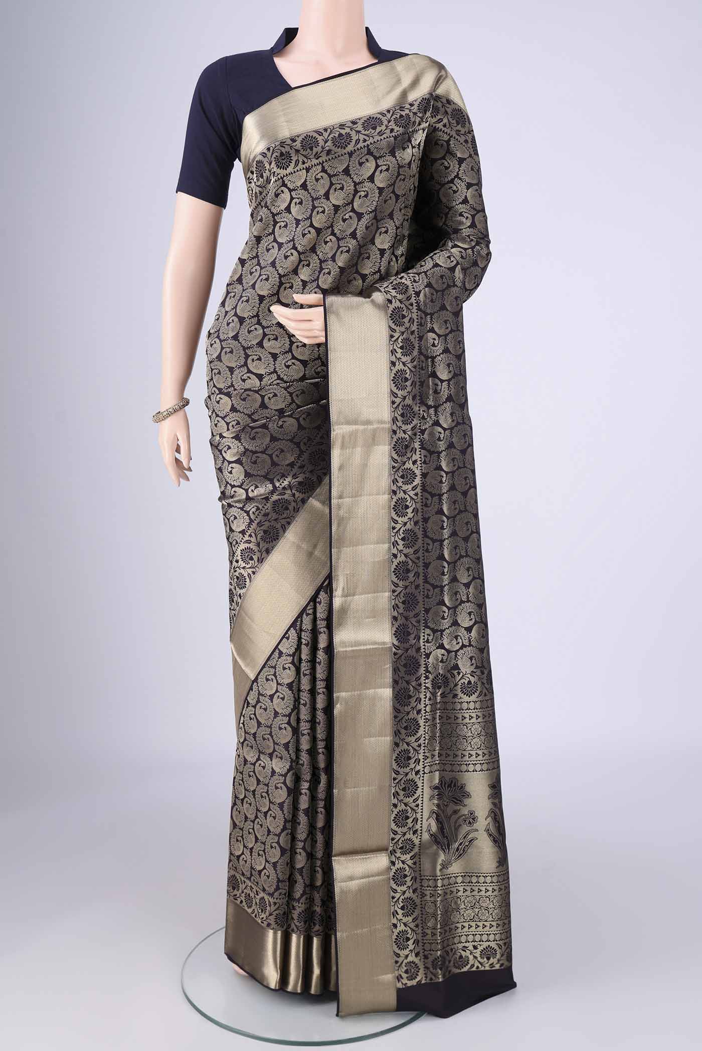 Navy Blue Soft Silk Saree with Zari Brocade on the body and Zari Border.  displayed on a mannequin
