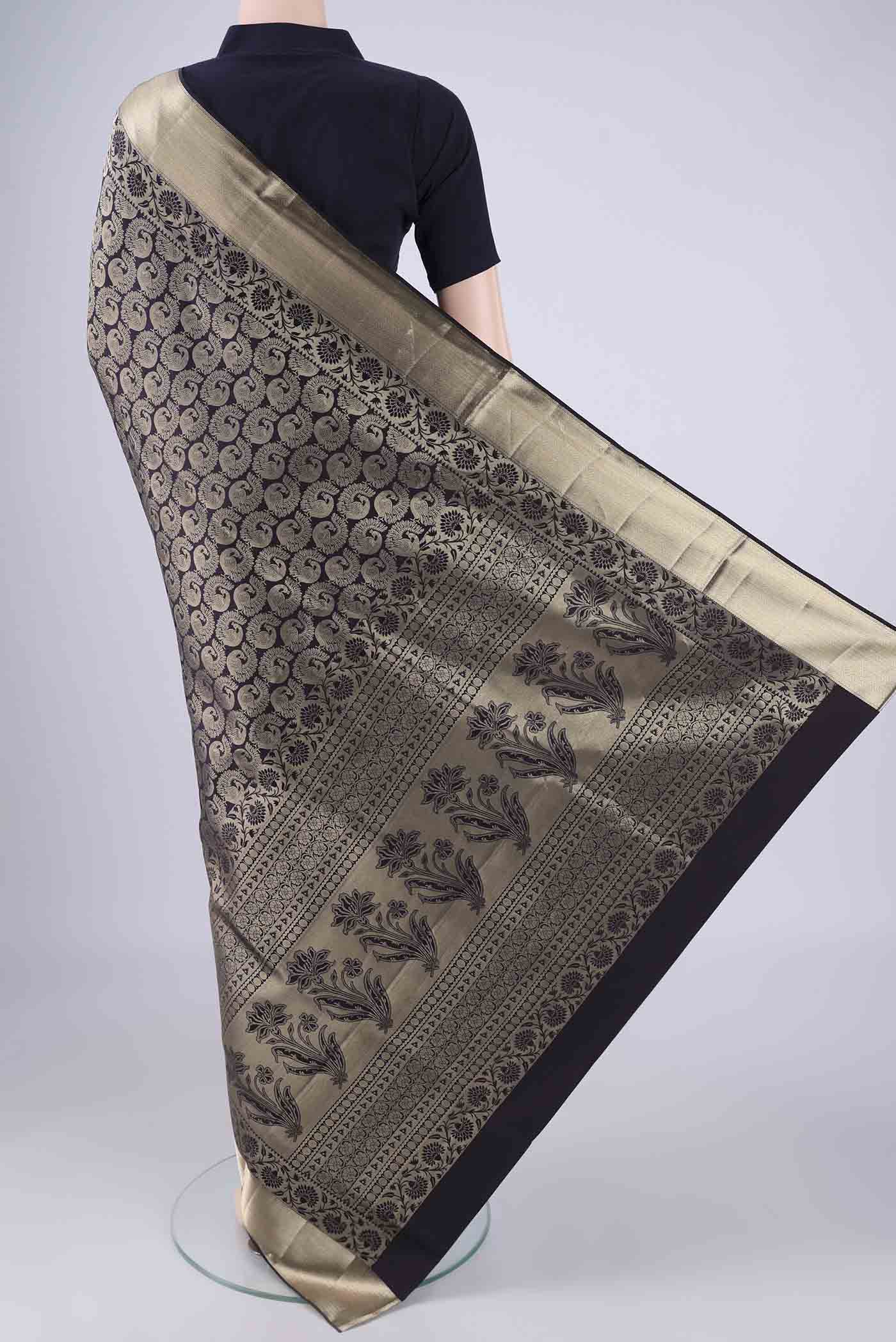 Flat view of Navy Blue Soft Silk Saree with Zari Brocade on the body and Zari Border. 
