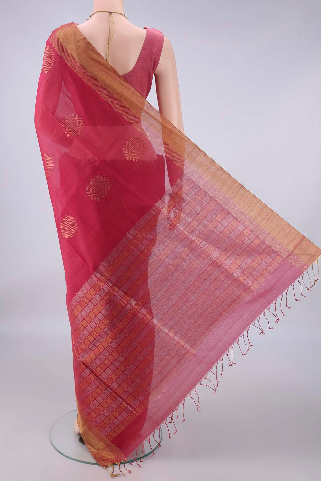Flat view of Coral Silk Cotton Saree with Zari Butta on the body and Zari Border. 