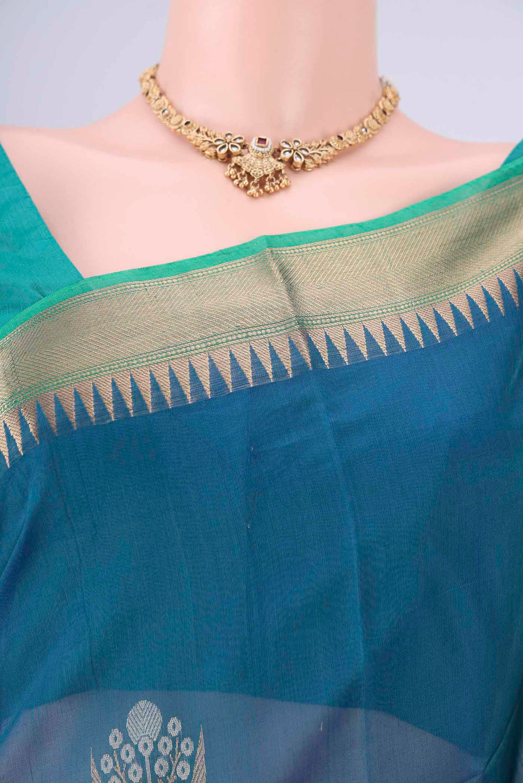Border image of Peacock Blue Kora Cotton Saree with Zari Butta on the body and Zari Border. 