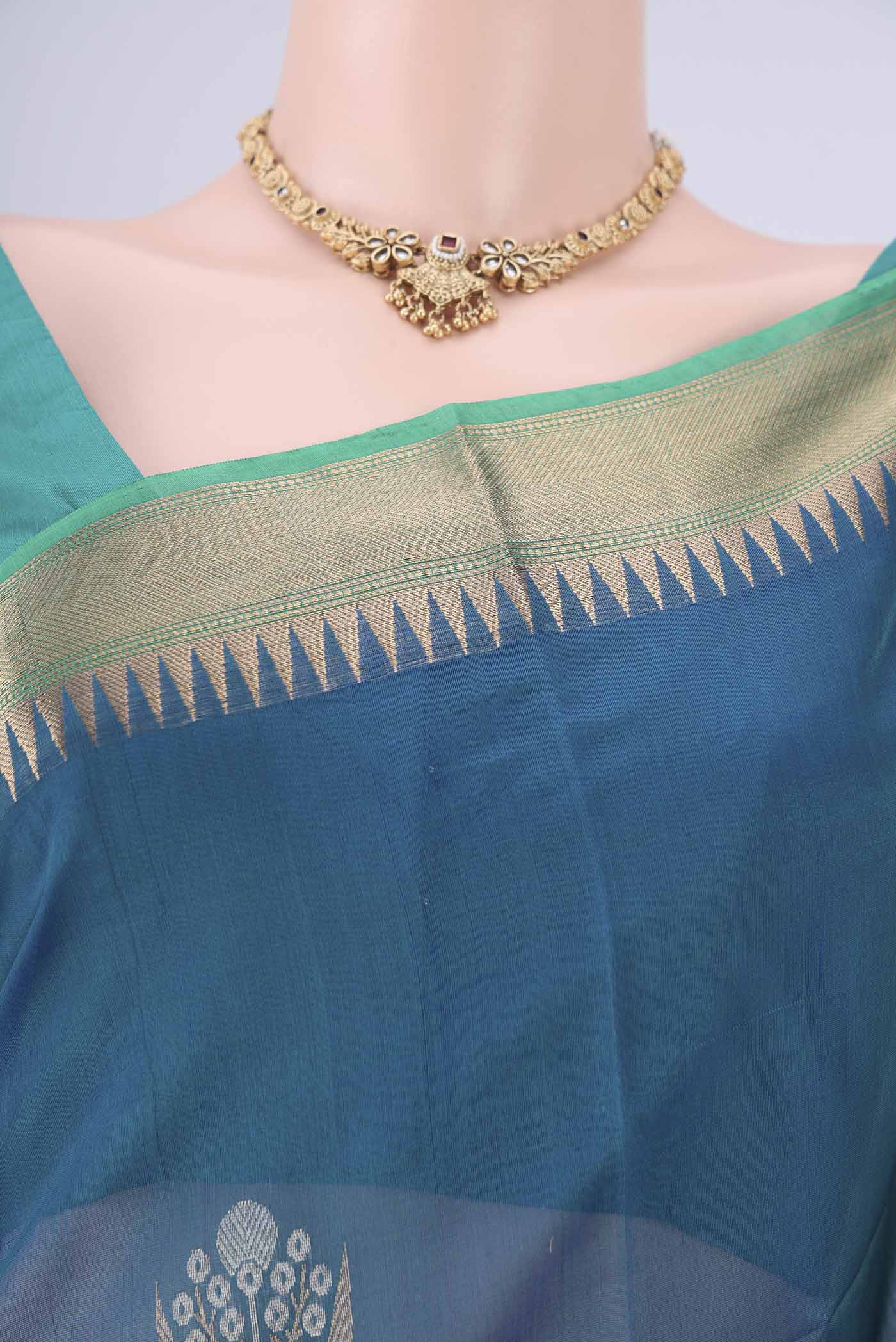 Border image of Peacock Blue Kora Cotton Saree with Zari Butta on the body and Zari Border. 