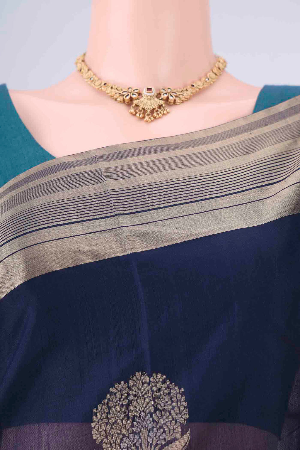 Border image of Navy Blue Kora Cotton Saree with Zari Butta on the body and Zari Border. 