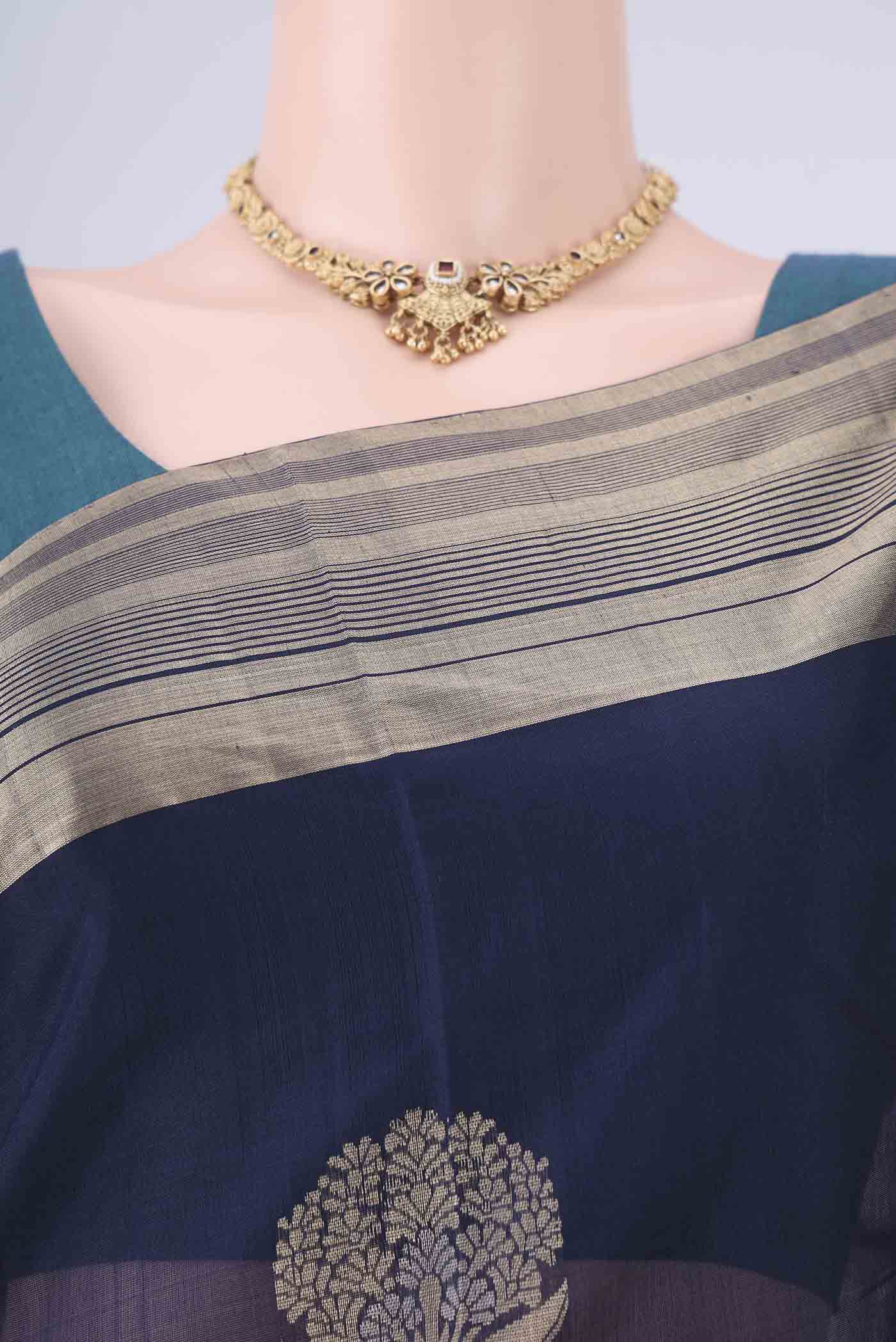 Border image of Navy Blue Kora Cotton Saree with Zari Butta on the body and Zari Border. 