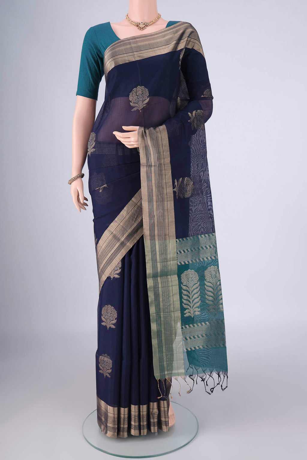 Navy Blue Kora Cotton Saree with Zari Butta on the body and Zari Border.  displayed on a mannequin
