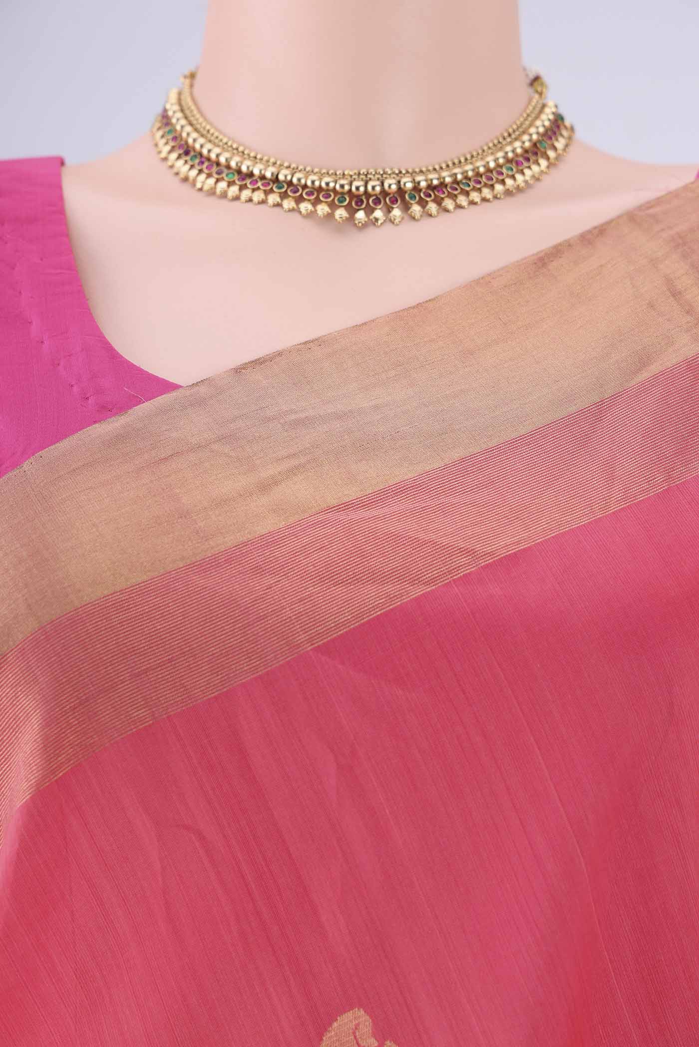 Border image of Peach Kora Cotton Saree with Zari Butta on the body and Zari Border. 