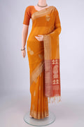 Mustard Silk Cotton Saree with Zari Butta on the body and Zari Border.  displayed on a mannequin