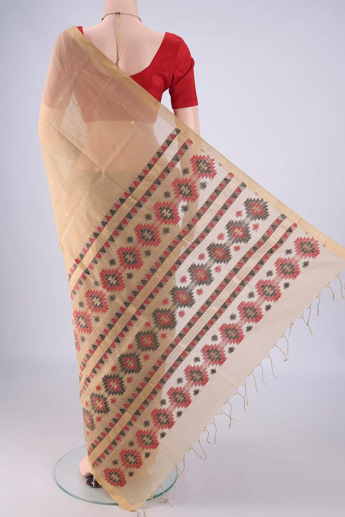 Flat view of Beige Silk Cotton Saree with Zari Butta on the body and Zari Border. 