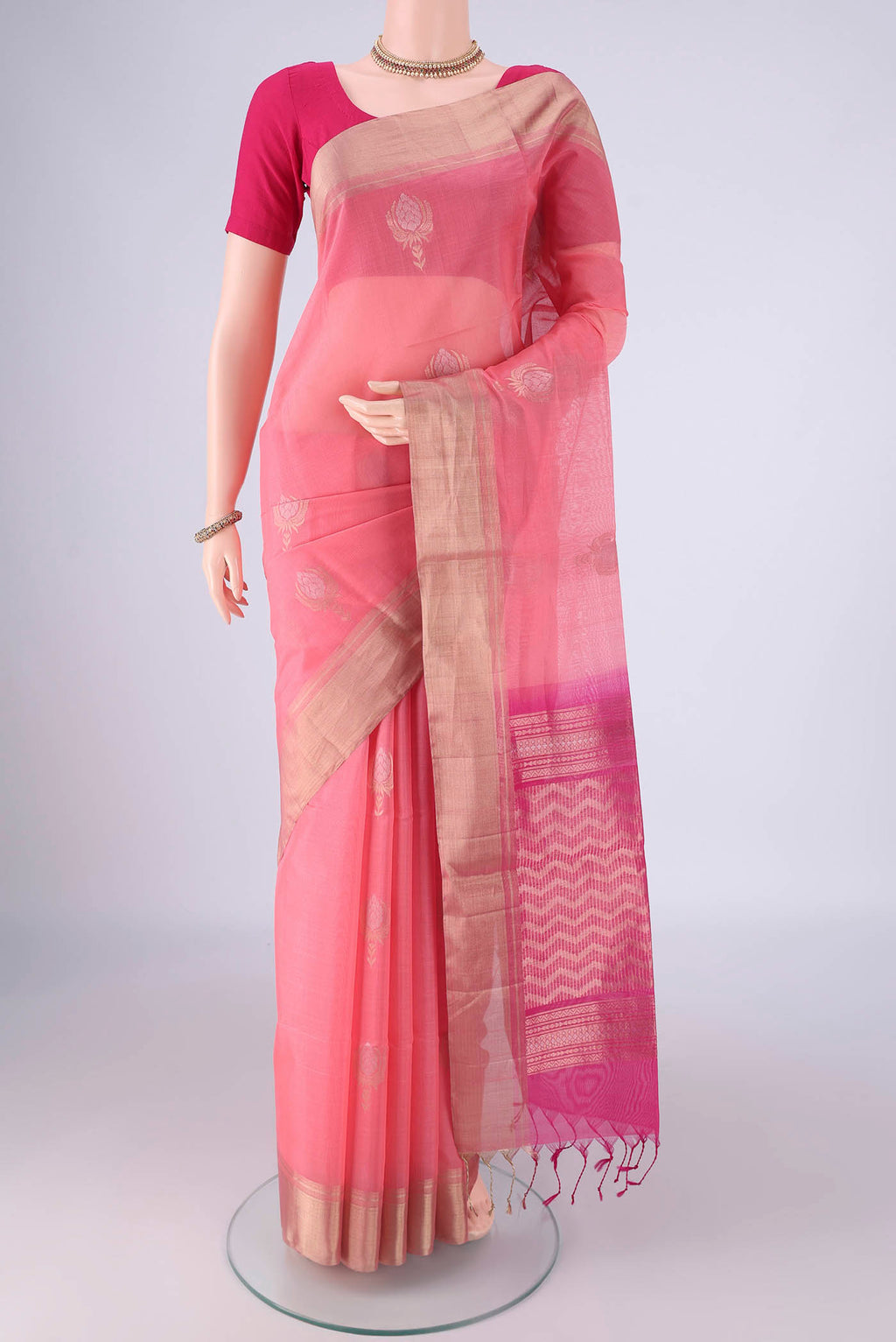 Rose pink Silk Cotton Saree with Zari Butta on the body and Zari Border.  displayed on a mannequin