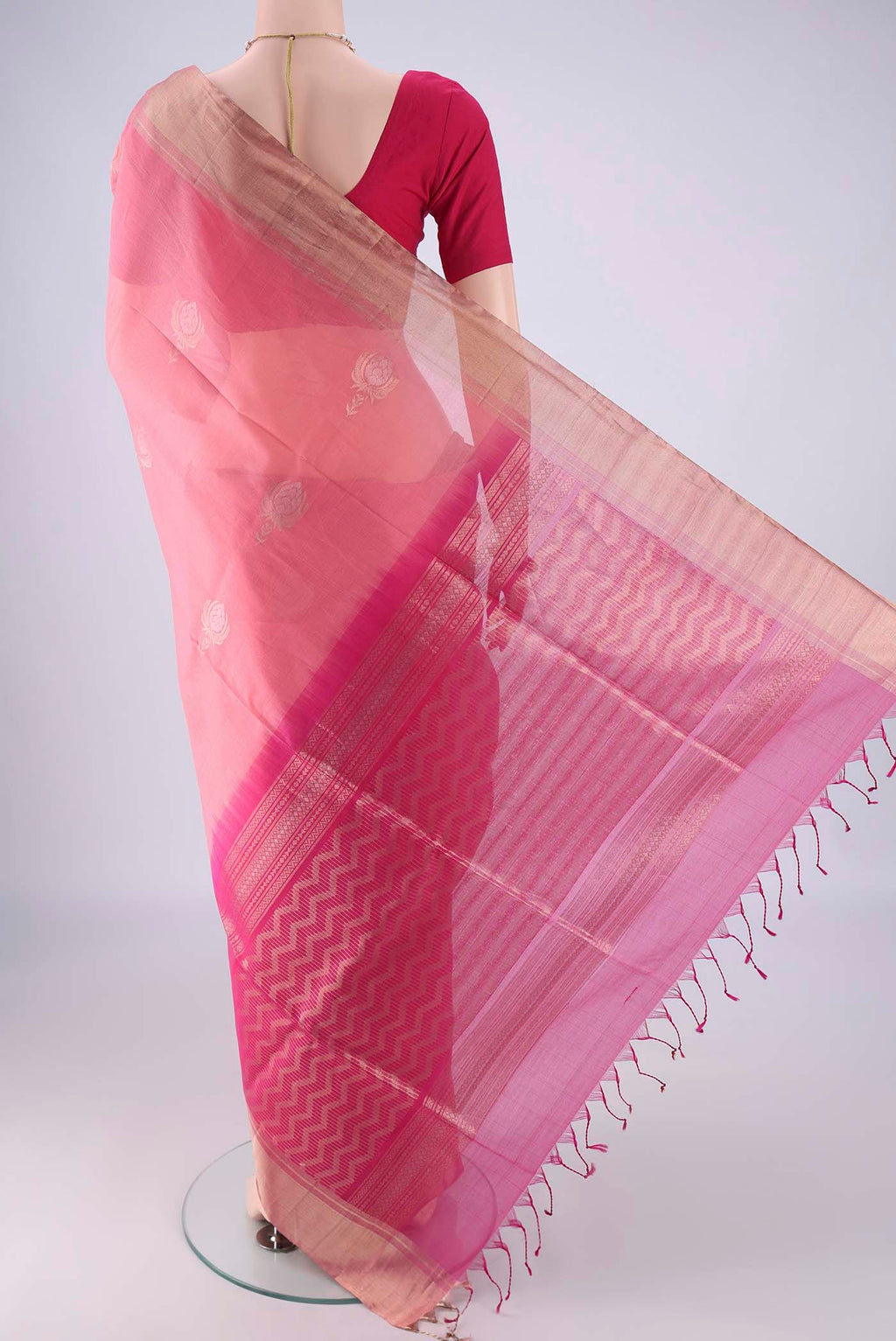 Flat view of Rose pink Silk Cotton Saree with Zari Butta on the body and Zari Border. 
