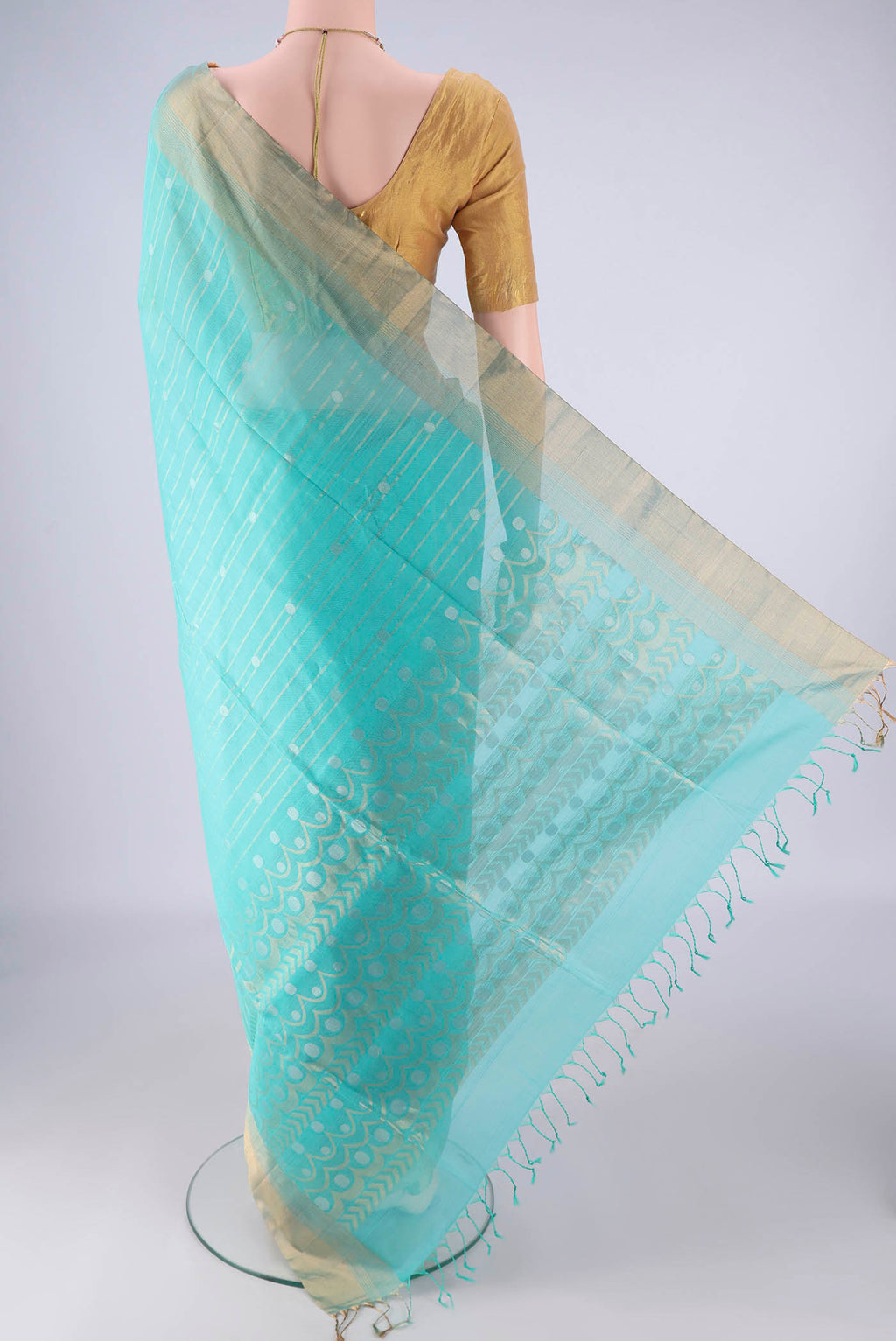 Flat view of Turquoise Silk Cotton Saree with Stripes on the body and Zari Border. 