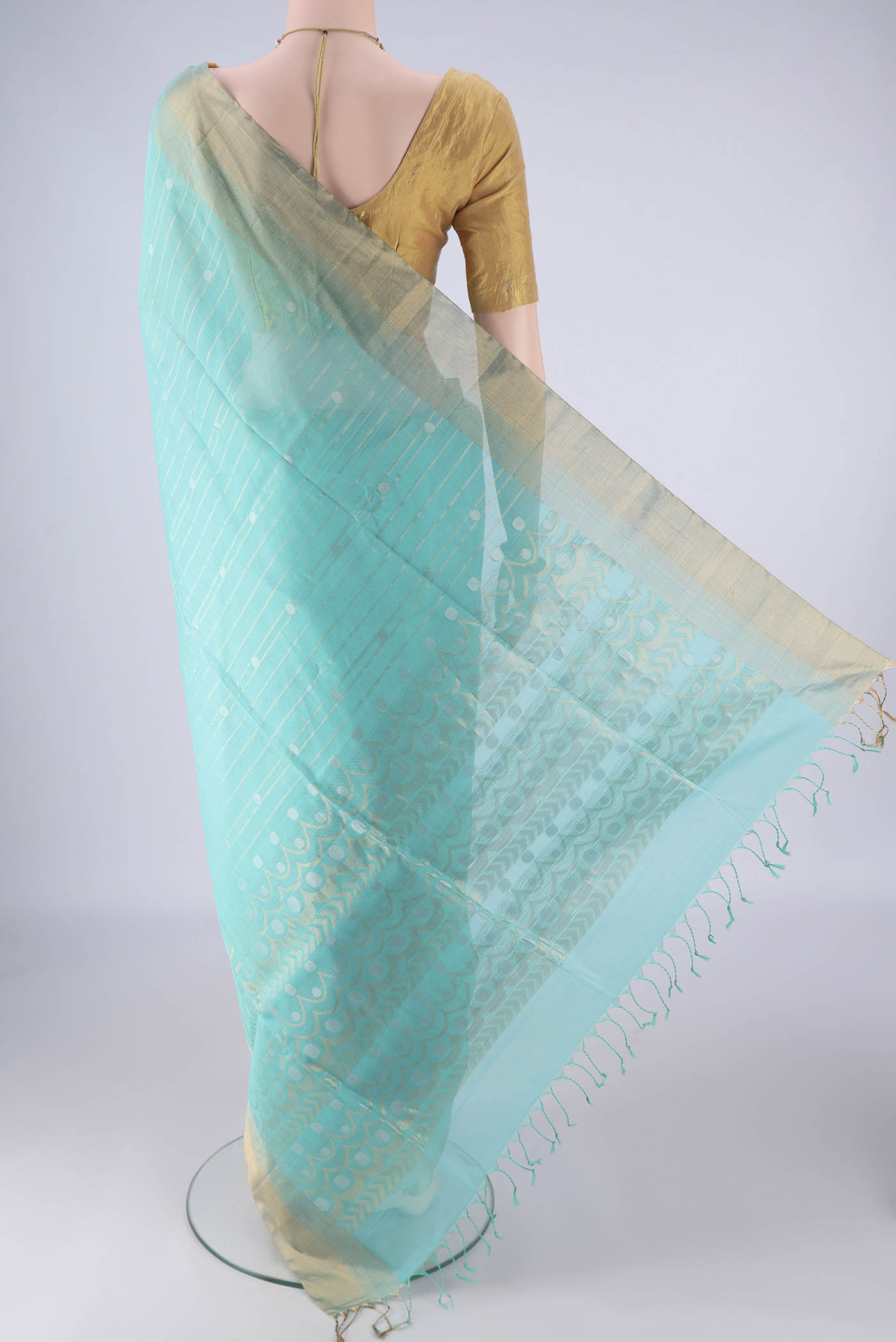 Flat view of Turquoise Silk Cotton Saree with Stripes on the body and Zari Border. 
