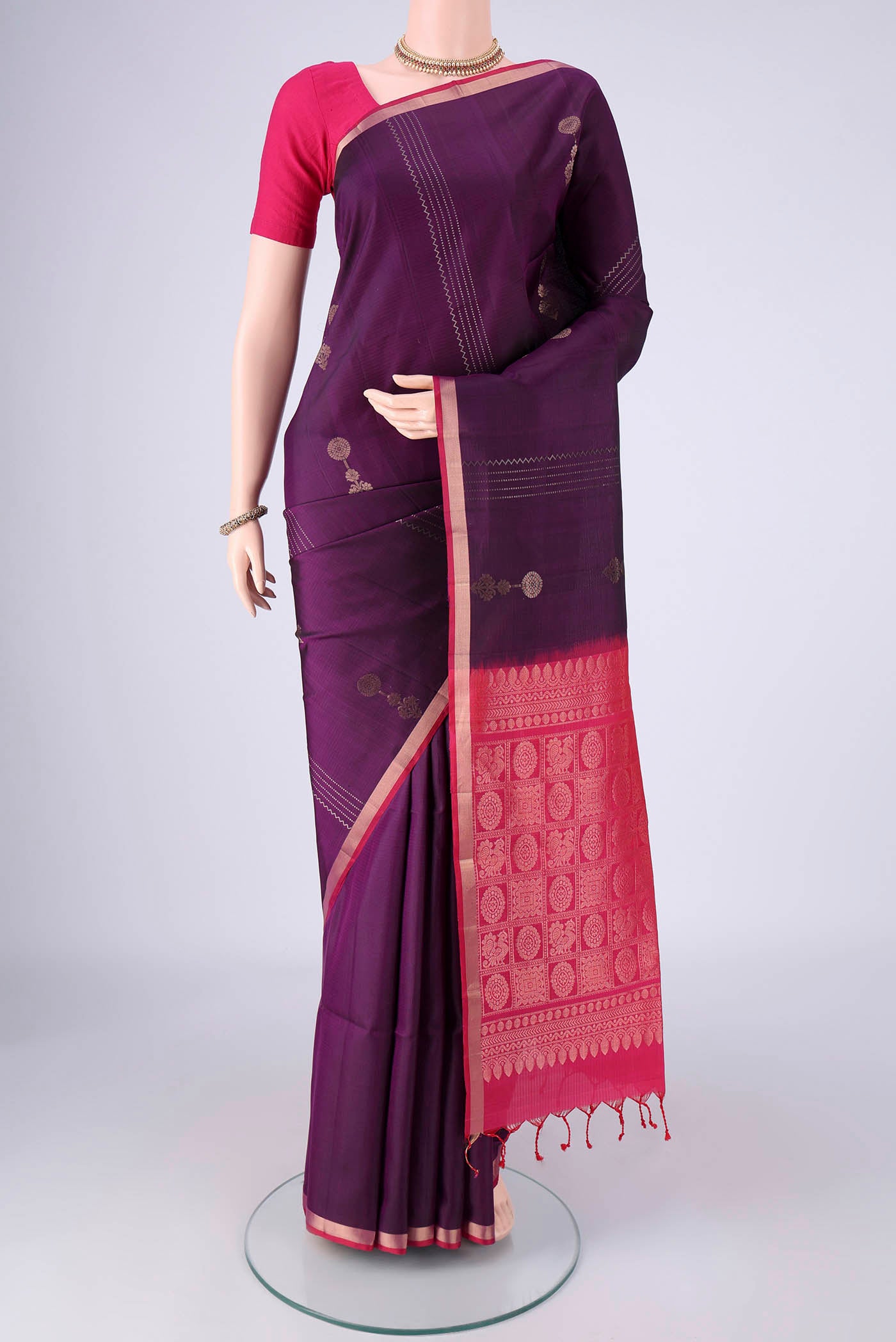 Purple Soft Silk Saree with Zari Butta on the body and Zari Border.  displayed on a mannequin