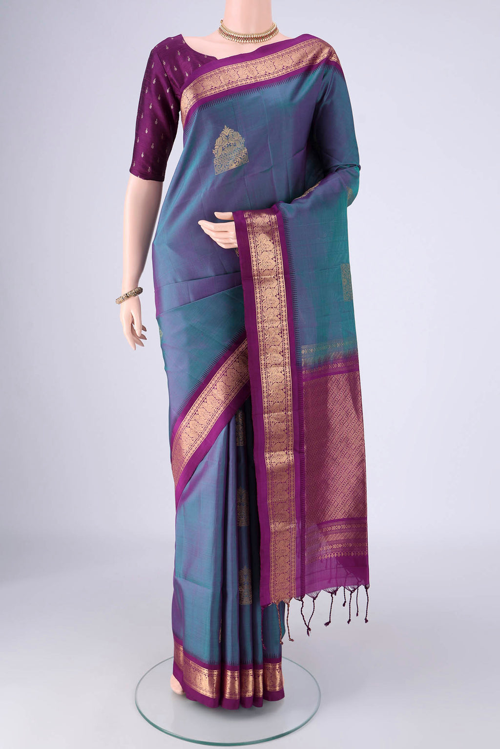 Blue Dual Tone Soft Silk Saree with Zari Butta on the body and Zari Border.  displayed on a mannequin
