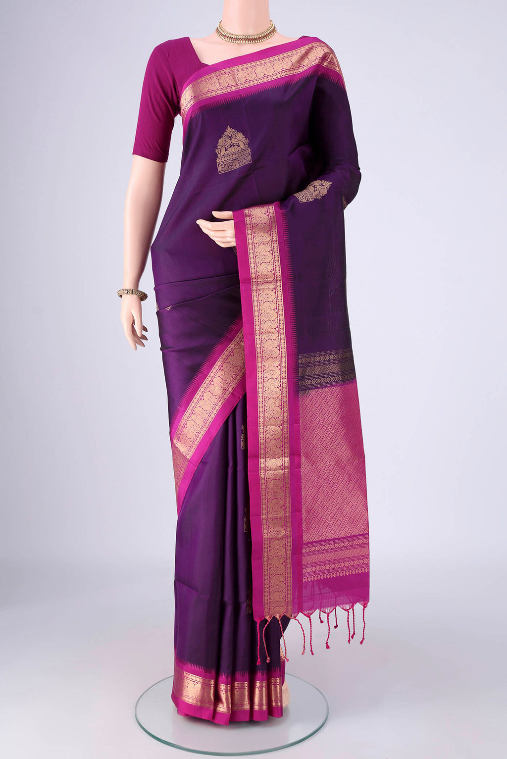 Purple Soft Silk Saree with Zari Butta on the body and Zari Border.  displayed on a mannequin