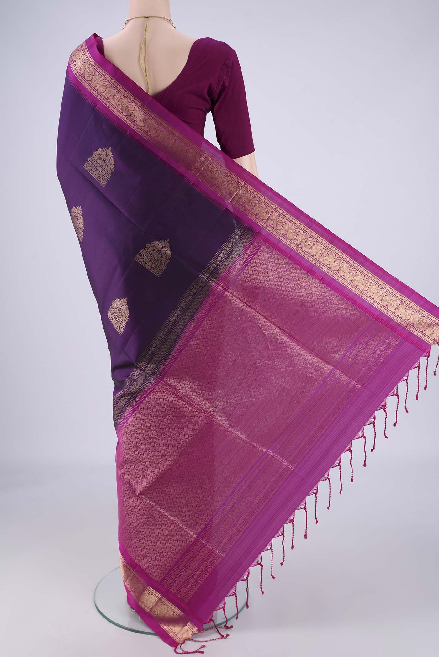 Flat view of Purple Soft Silk Saree with Zari Butta on the body and Zari Border. 