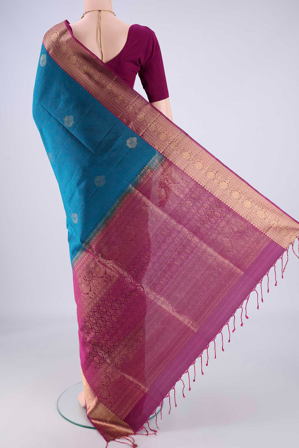 Flat view of Blue Soft Silk Saree with Zari Butta on the body and Without Border. 