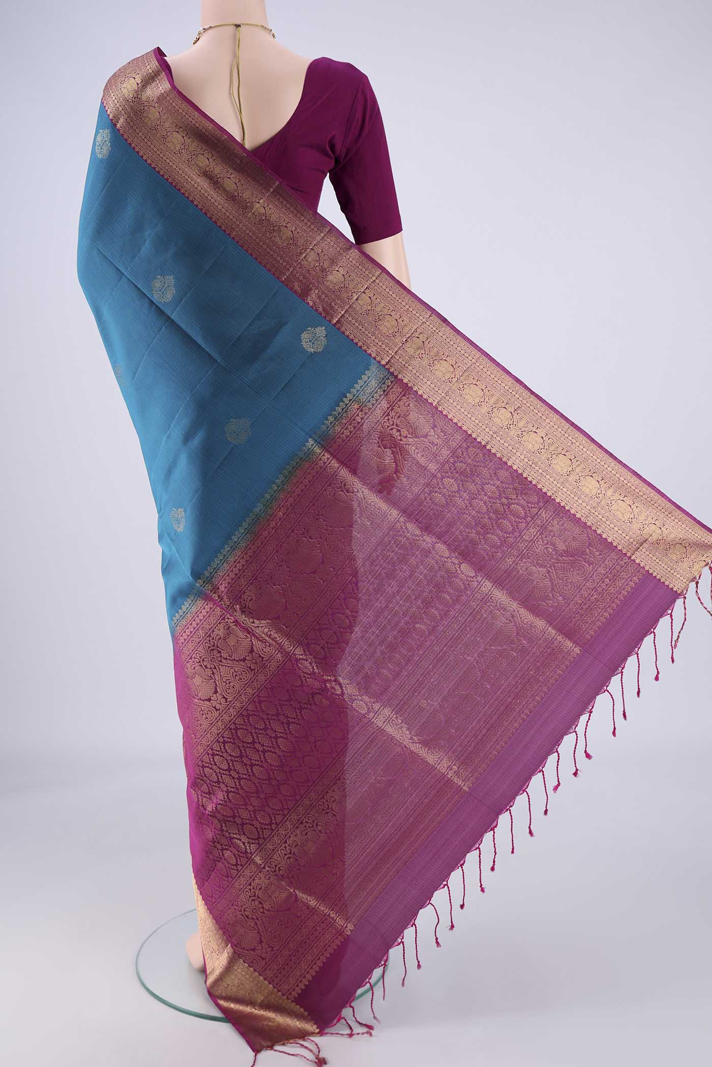 Flat view of Blue Soft Silk Saree with Zari Butta on the body and Without Border. 