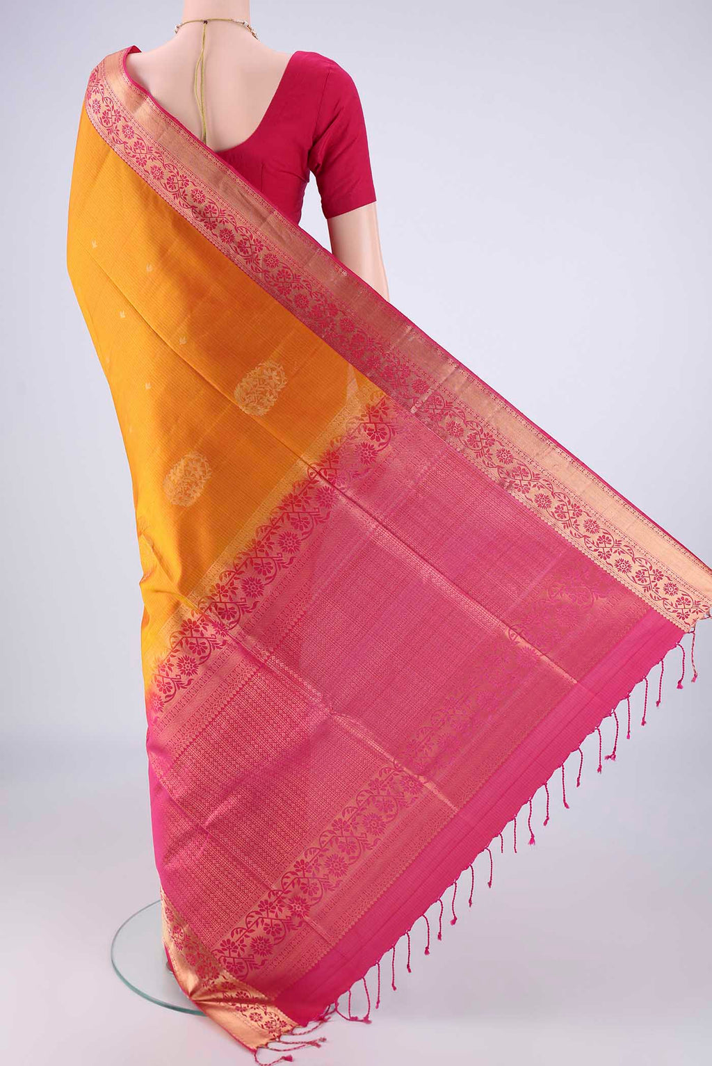 Flat view of Mustard Soft Silk Saree with Zari Butta on the body and Zari Border. 