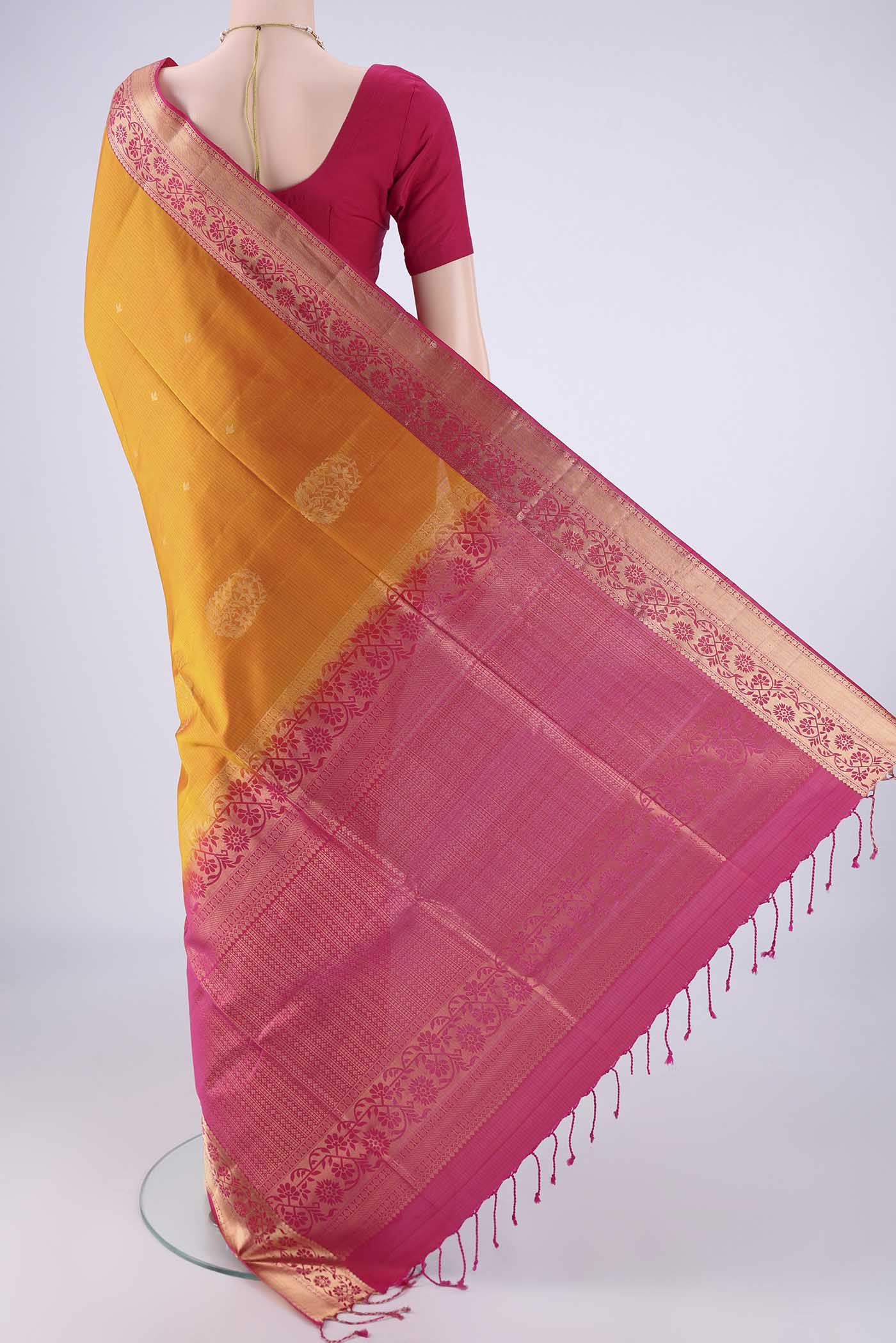Flat view of Mustard Soft Silk Saree with Zari Butta on the body and Zari Border. 