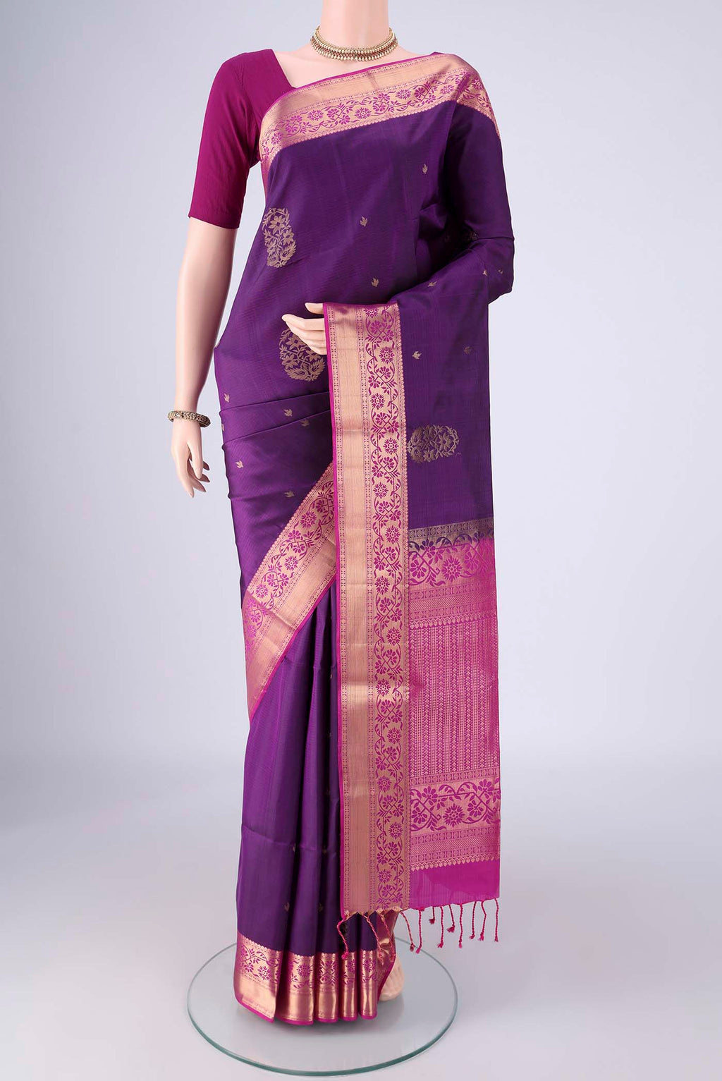 Purple Soft Silk Saree with Zari Butta on the body and Zari Border.  displayed on a mannequin