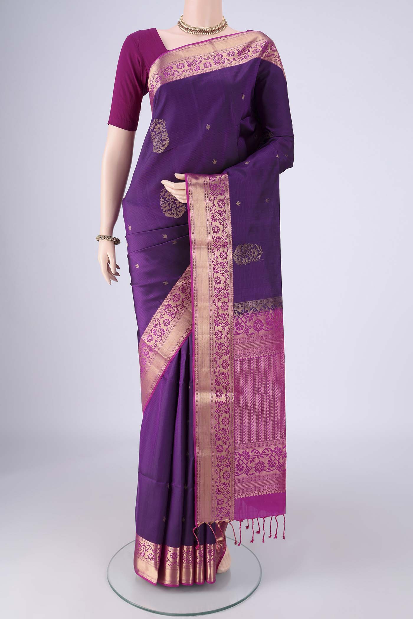 Purple Soft Silk Saree with Zari Butta on the body and Zari Border.  displayed on a mannequin