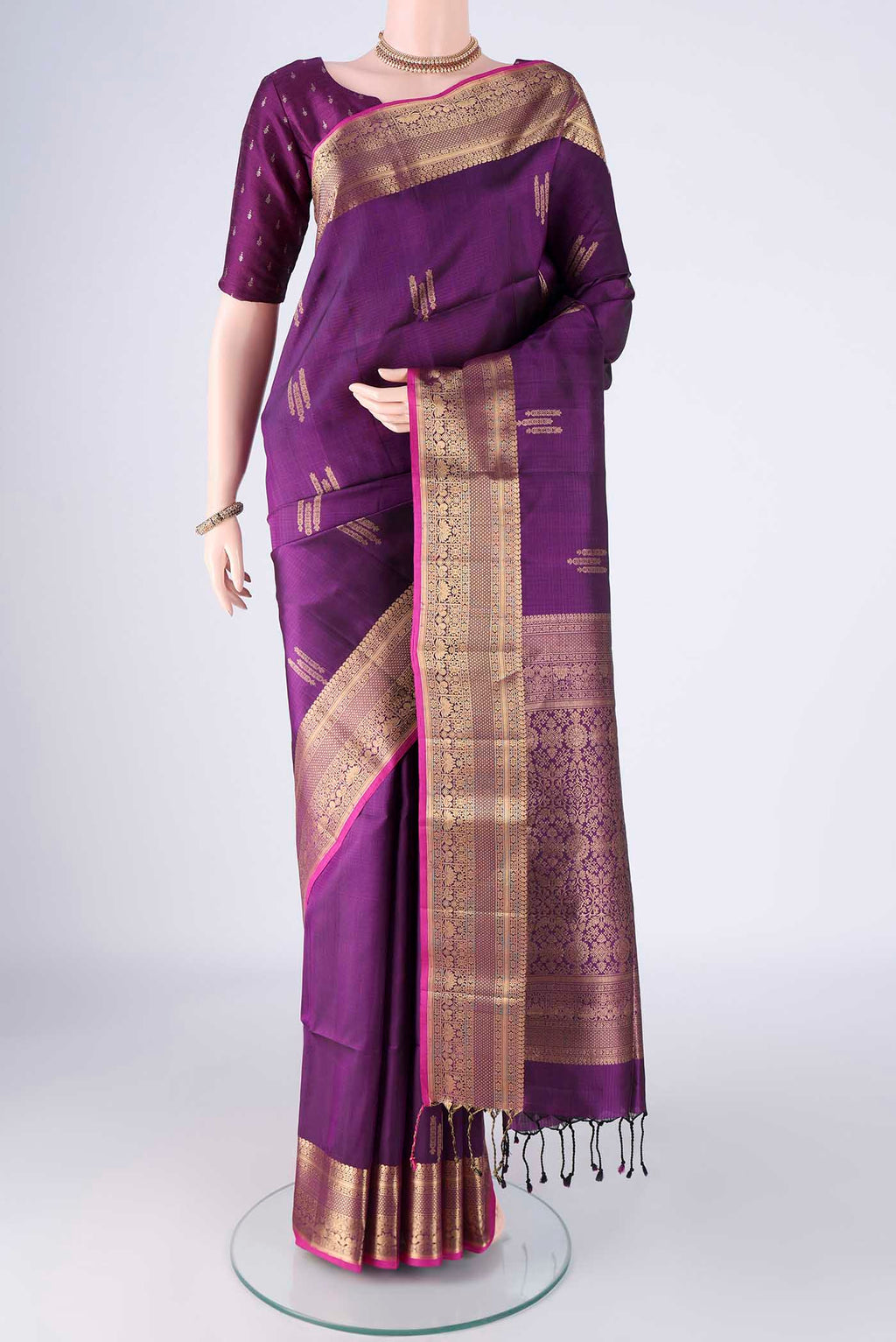 Purple Soft Silk Saree with Zari Butta on the body and Zari Border.  displayed on a mannequin