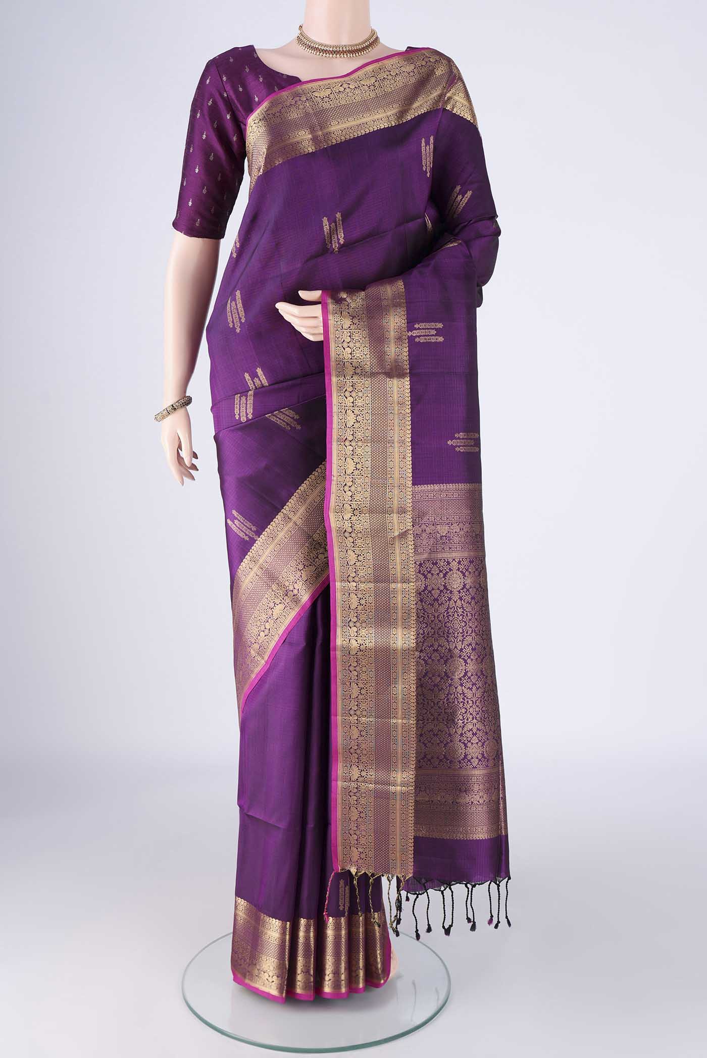 Purple Soft Silk Saree with Zari Butta on the body and Zari Border.  displayed on a mannequin
