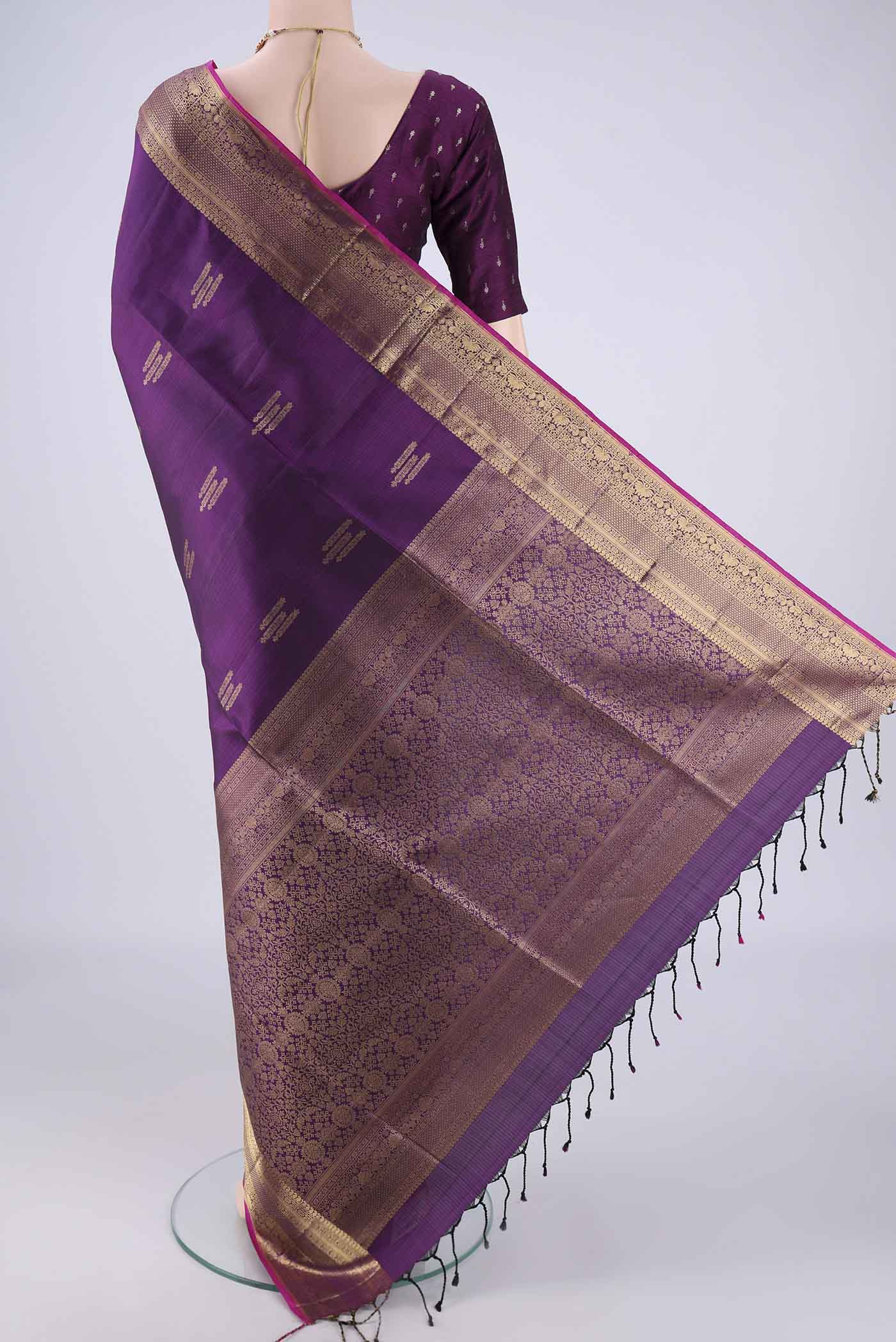 Flat view of Purple Soft Silk Saree with Zari Butta on the body and Zari Border. 