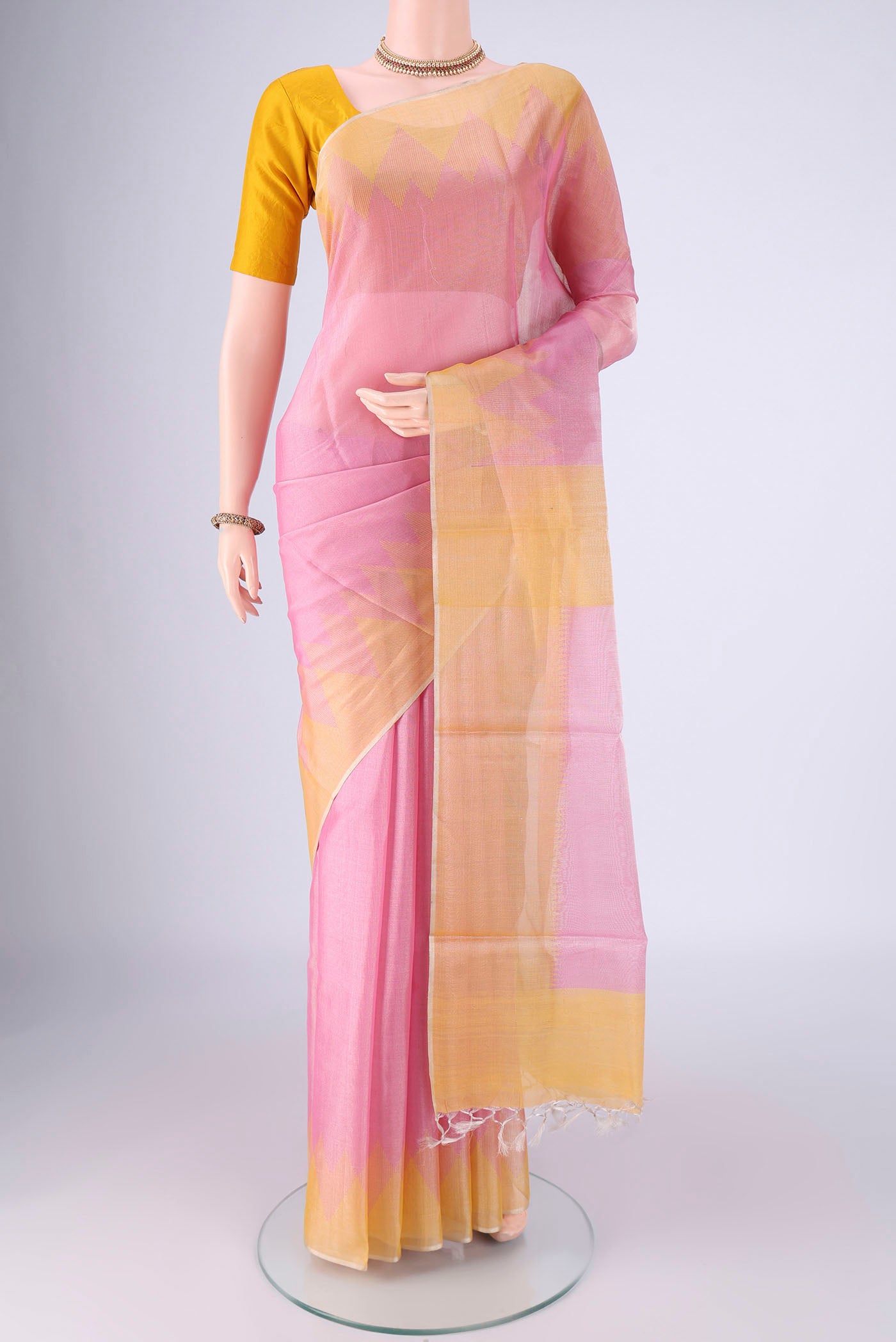 Pink MP Tussar Saree with Plain Body and Temple Border.  displayed on a mannequin