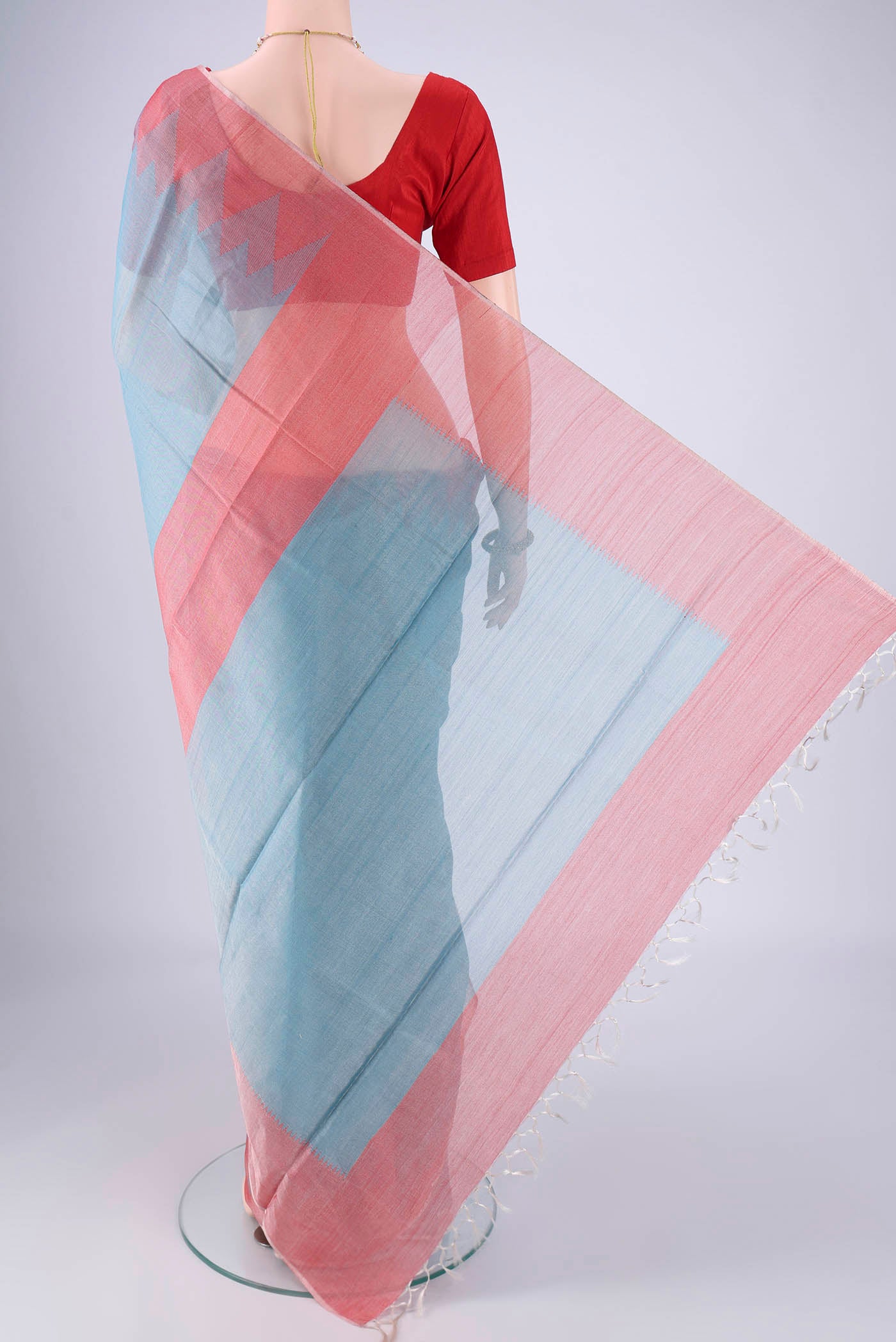 Flat view of Sky Blue MP Tussar Saree with Plain Body and Temple Border. 