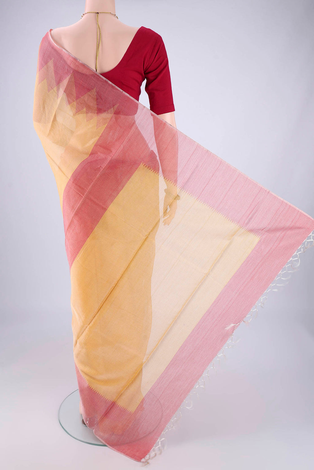 Flat view of Yellow MP Tussar Saree with Plain Body and Temple Border. 